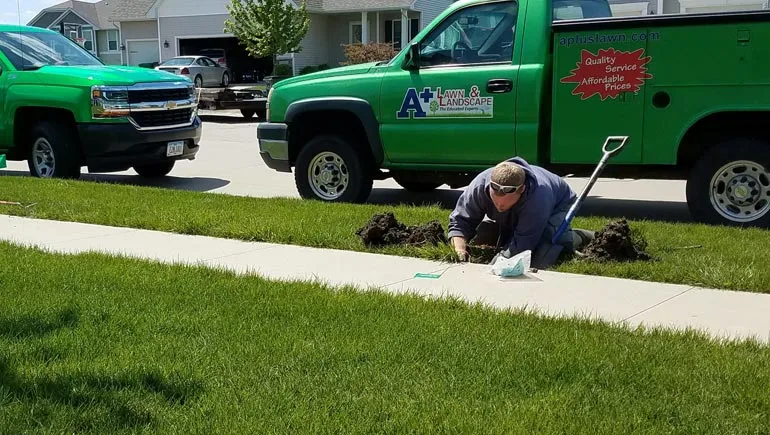 One of our irrigation specialists making repairs to a irrigation system at a home in Ankeny.