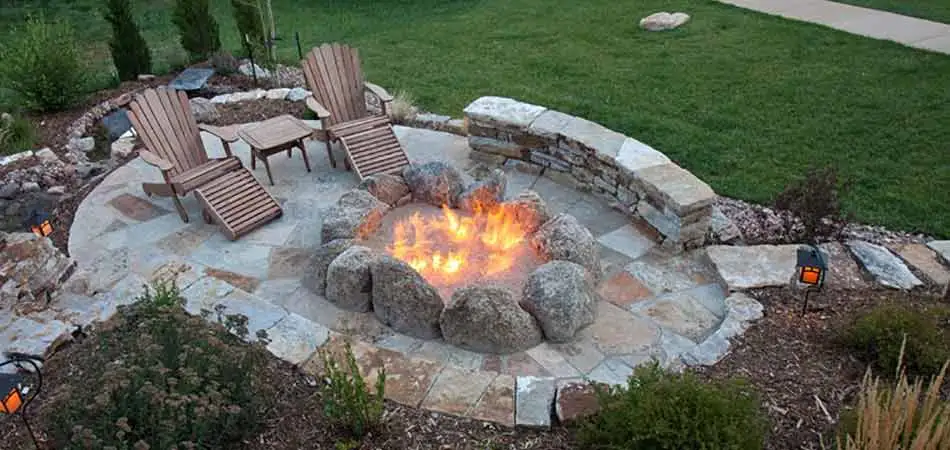 Custom flagstone and stone fire pit and patio near Des Moines, IA.