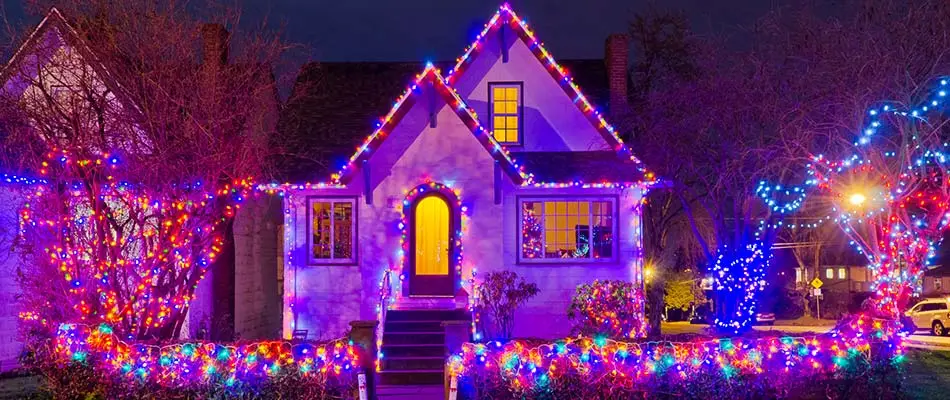 Colorful holiday lighting installed on a home in  West Des Moines, IA.
