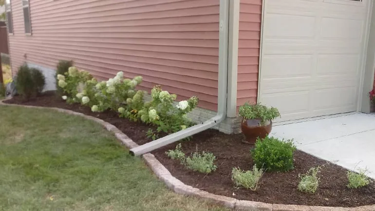 Landscaping design and installation around a property in Ankeny, Iowa.