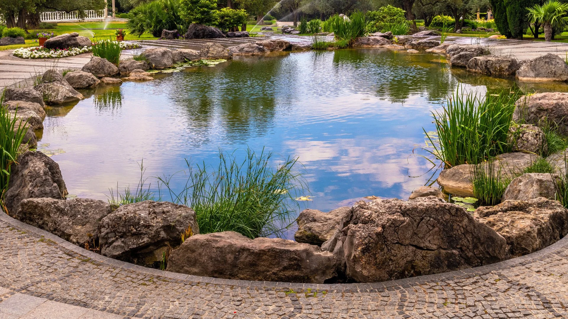 A beautiful rock waterfall professionally installed by our skilled employees at a home in West Des Moines, IA.