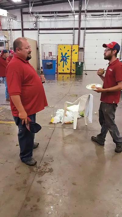 Two of our employees discussing the details of a project in Ankeny over lunch.