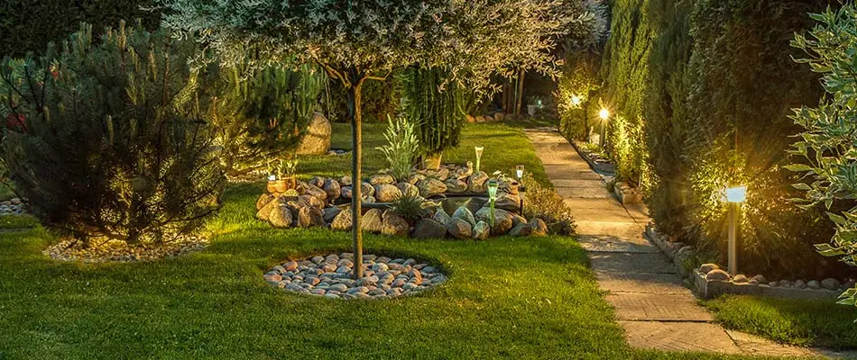 Path illuminated with landscape lighting installed at a residence in West Des Moines, IA.
