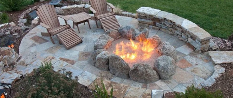 Gas fire pit and seating walls on a patio in Des Moines, IA.