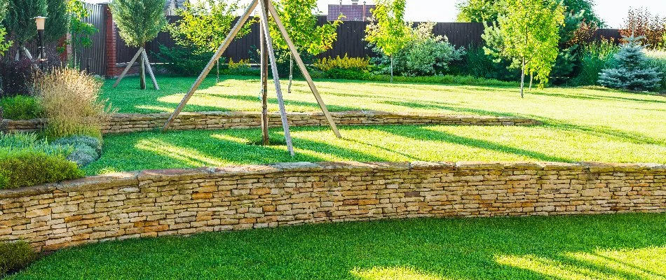 Green lawn above a retaining wall in Des Moines, IA.