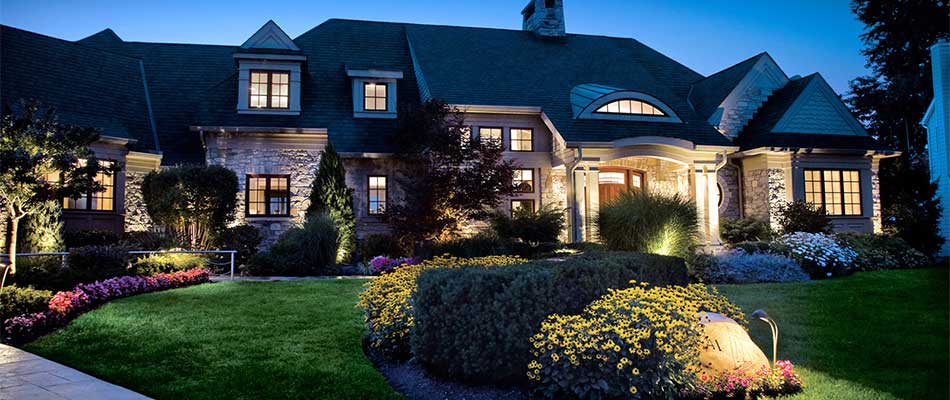 Home in Ankeny, IA with landscape and outdoor lighting features.