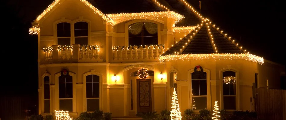 House in Des Moines, IA, with warm white Christmas lights.