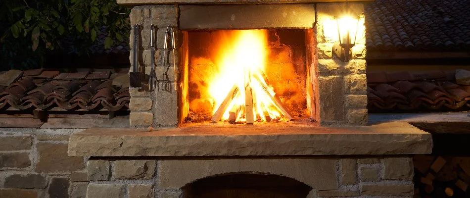 Wood-burning outdoor fireplace in Des Moines, IA.