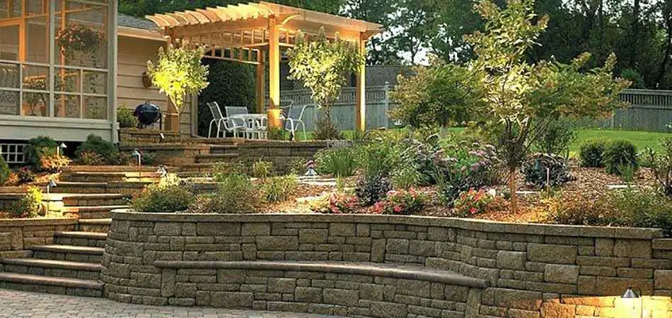 Landscape lighting at this Des Moines home highlights landscaping and other features.