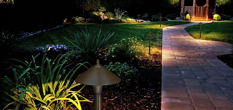 Landscape lighting by a walkway in Des Moines, IA.