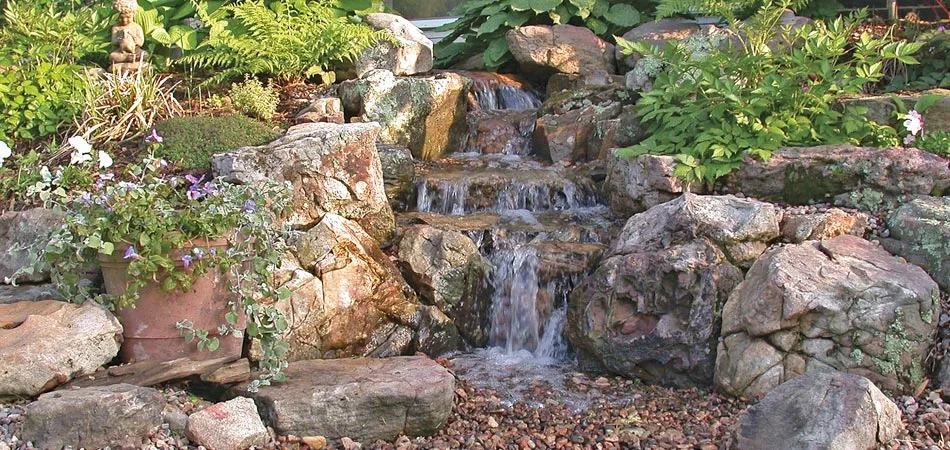 A rock waterfall that we regularly maintain and treat the water.