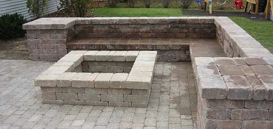 Example of a fire pit with a seating wall installed around it in Ankeny.