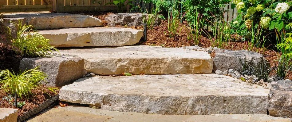Flagstone outdoor step with plants and shrubs in Des Moines, IA.