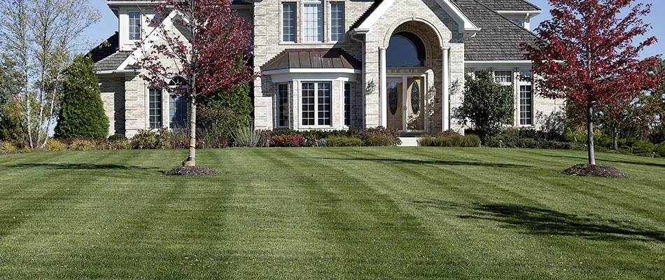 A home with regular lawn mowing and maintenance in Adel, IA.