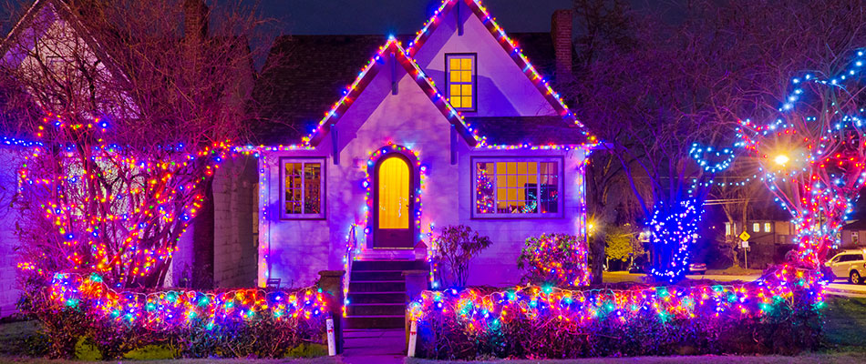 A home with colorful LED holiday lighting installed in Hartford, IA. 