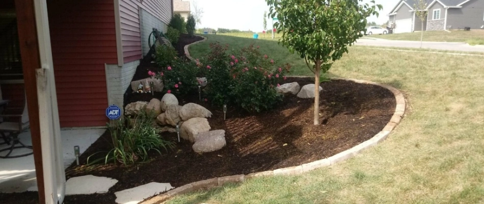 Mulch installed for landscape bed plantings in Clive, IA.