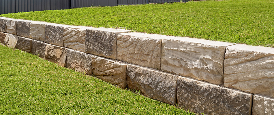 A retaining wall installed on a sloped property in Adel, IA. 